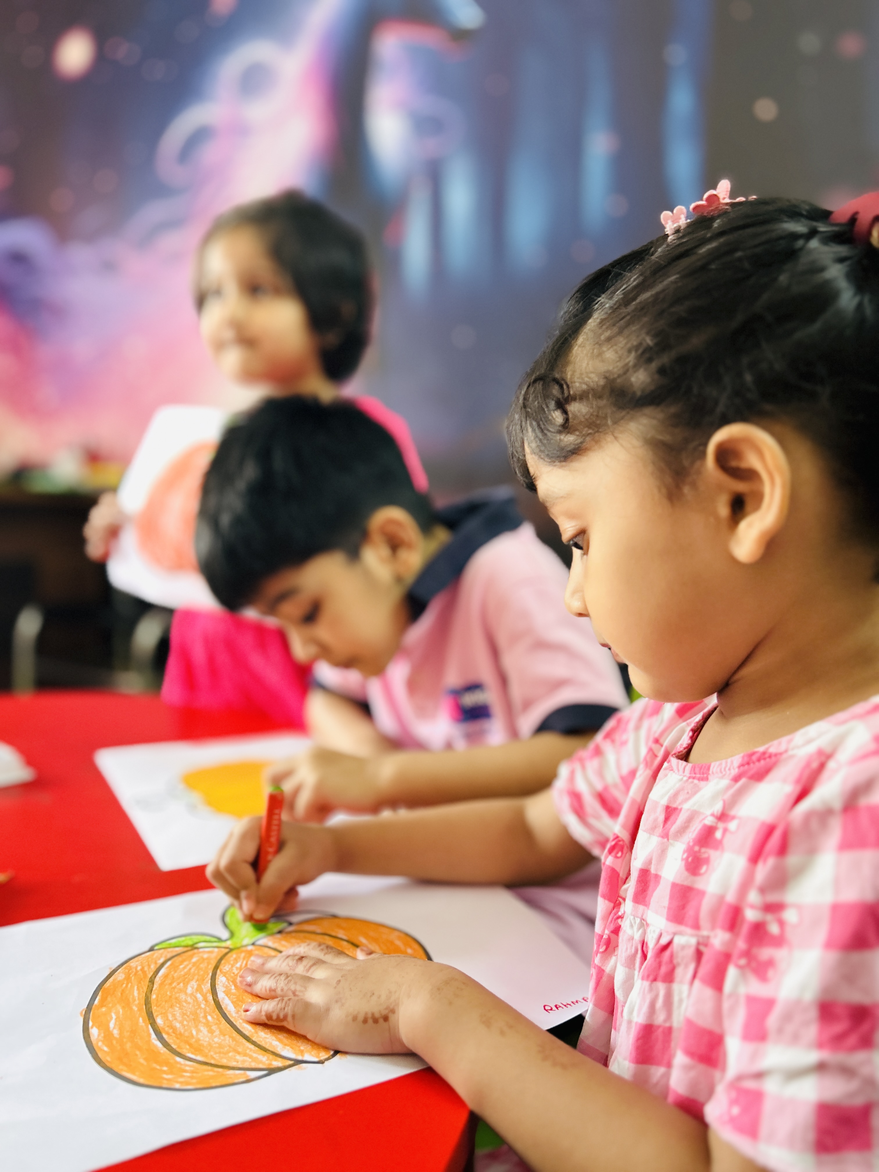 Child practicing fine motor skills and school readiness.